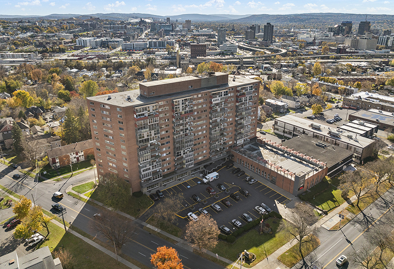 Papaleo and Finn of CBRE Upstate NY broker sale of Regency Tower Apartments